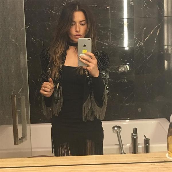 Sarah Shahi taking a selfie