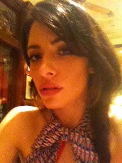 Sarah Shahi taking a selfie