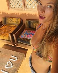 Nina Agdal in a bikini taking a selfie