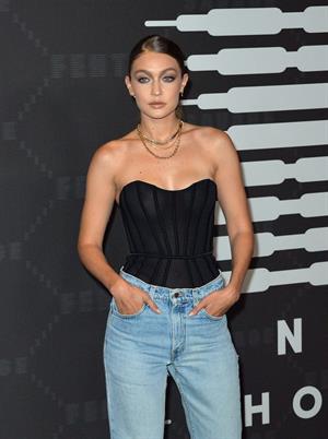 Gigi Hadid braless boobs in a see through top showing off her tits seen by paparazzi with Cara Delevingne and Joan Smalls.













































