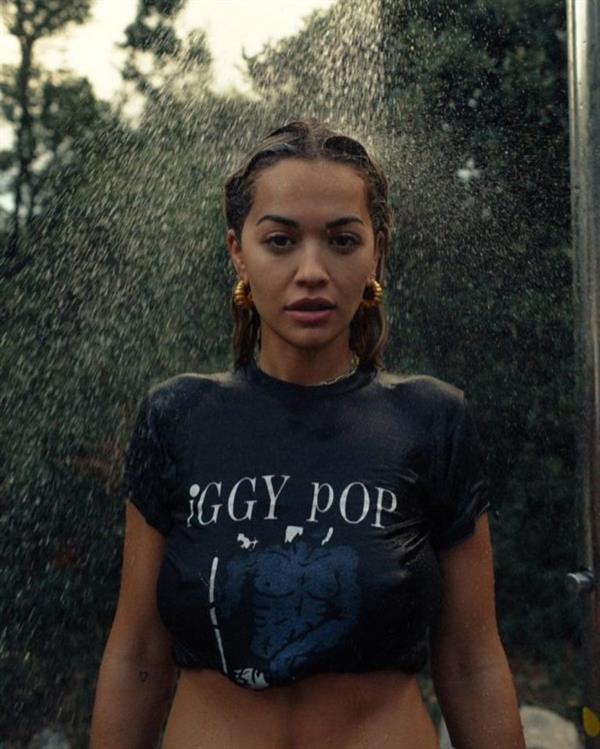 Rita Ora braless boobs in a wet t-shirt showing off her tits.




















