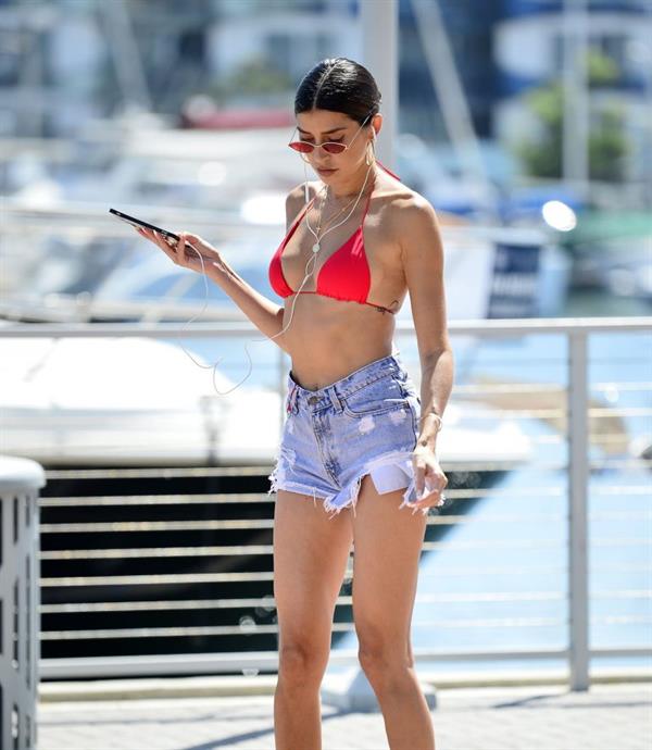 Nicole Williams rollerblading in a sexy little red bikini top seen by paparazzi.



























