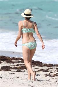 Minnie Driver in a bikini - ass