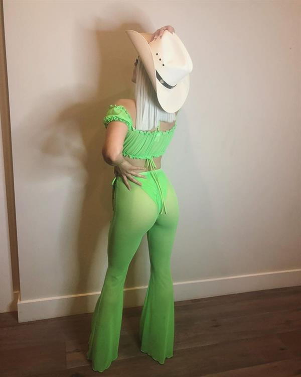 Ariel Winter sexy ass in a thong and green see through outfit dressed as a cowgirl for Halloween.





