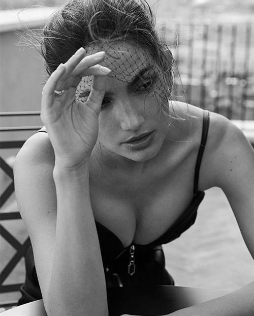 Lily Aldridge Bikini Pictures Lily Aldridge boobs showing nice cleavage in a tight black top.