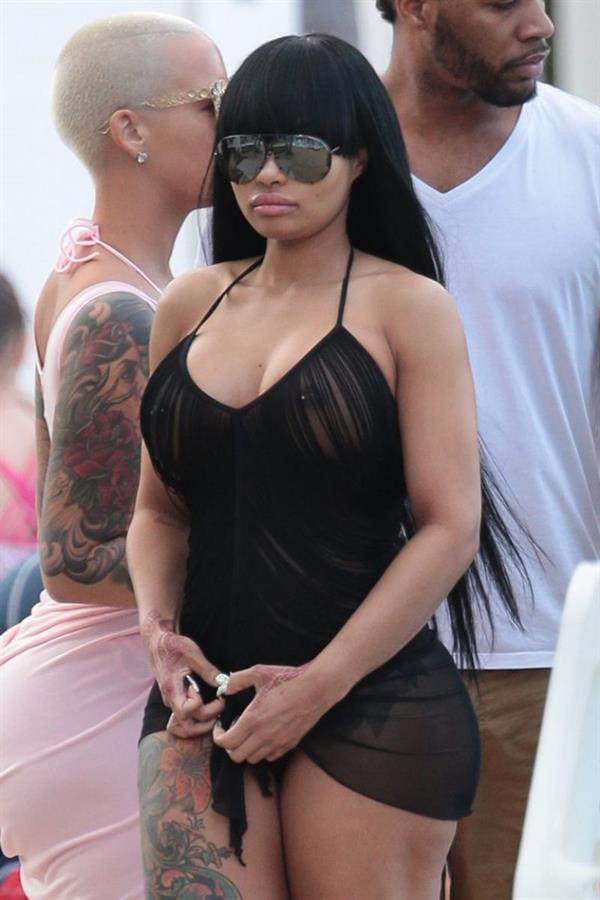 Blac Chyna braless boobs in a see through top showing off her big tits with pierced nipples and ass in a thong with Amber Rose seen by paparazzi.