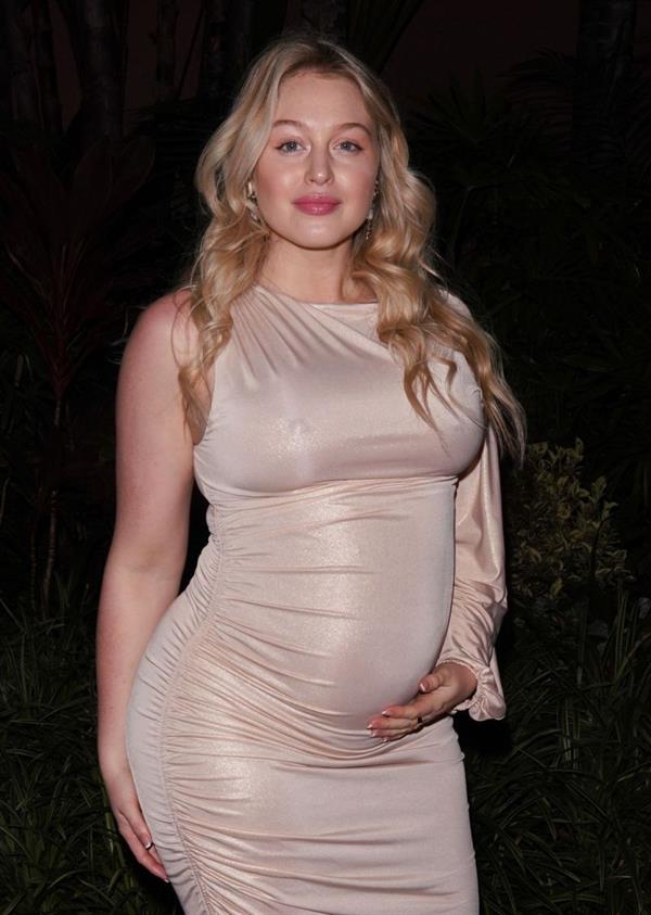Iskra Lawrence braless boobs showing off her big tits and pregnant belly in a sexy dress seen by paparazzi at the Golden Globes pre party.