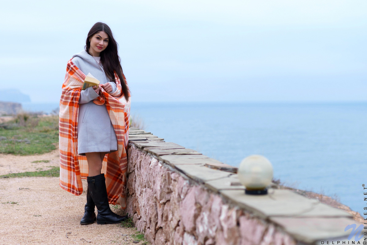 Long chestnut hair waves in the wind before Delphina comes inside. Relocating to the bedroom, she peels off her panties and slides her fingers down her slippery twat. She's already wet and ready to cum, so watch her slide her fingers into her cream filled fuck hole as she moans in pure delight.