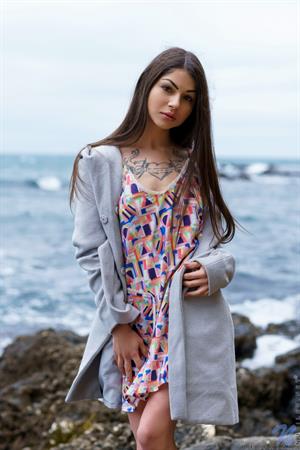 Delphina Nude Pictures Shrugging off her trench coat, Delphina soon follows the thicker material with her dress. Her magnificent breasts are tipped with the most suckable hard nipples you've ever seen, and when she turns around you'll want to feast on that ass. Her meaty bare pussy is the cherry on top as she spreads her juices everywhere.