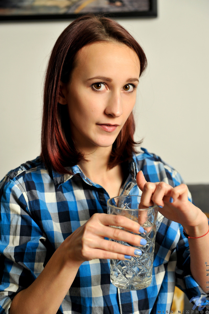 You'll want to lure in super skinny cutie Miss Nimpho, to get a handful of those perky titties and feel up those big hard nipples. When you're had your fill of her boobs, follow the trail of moisture from her water down to her bare twat that is wet with her juices and ready to masturbate.