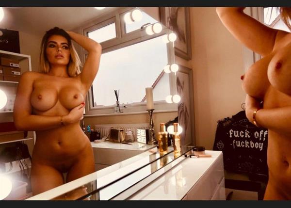 Megan Barton Hanson nude behind the scenes full frontal photo showing her topless boobs and naked pussy in the mirror.