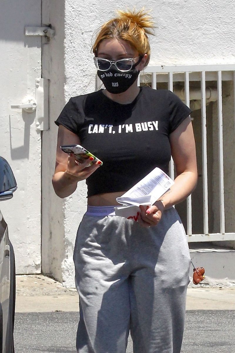 Ariel Winter braless boobs in a sexy little black crop top showing off her big tits also wearing a mask seen by paparazzi out shopping.
