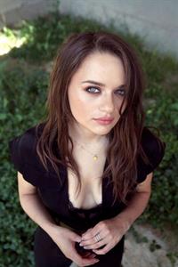 Joey King boobs showing nice cleavage in a low cut black suit and a sexy black lace bra.