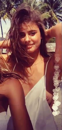 Taylor Hill braless boobs in sexy lingerie accidentally flashing her nude big tits with a nip slip wardrobe malfunction from an instagram live.