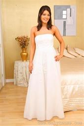  Lovely bride slips out of her wedding dress. 