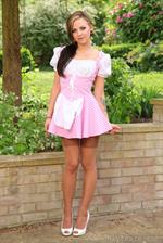  Sexy Miss Muffet outdoors in tan stockings. 