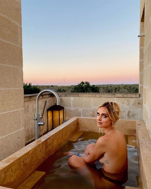 Chiara Ferragni topless new photos in an outdoor bathtub showing off nice sideboob with her nude big tits wearing just thong bikini bottoms.