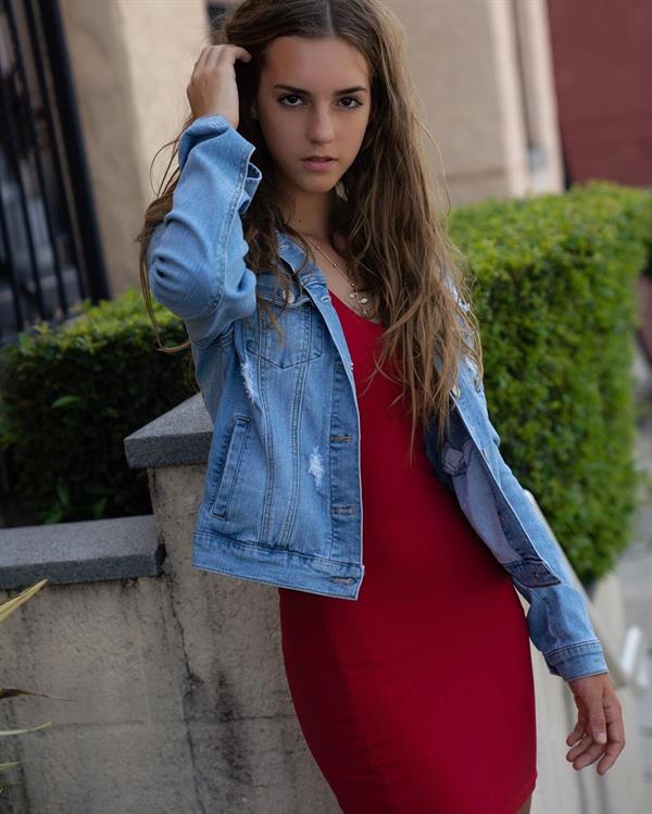 Emily Feld in a Tight Red Dress