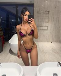 Annelese Milton in a bikini taking a selfie