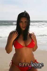 Sunny Leone wearing a red bikini
