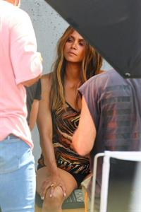 Halle Berry braless boobs in a see through minidress showing off her big tits clearly showing her nipple and panties with an Upskirt during a photoshoot.