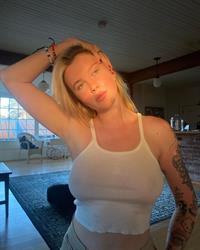 Ireland Baldwin braless boobs in a see through sexy white top showing off her big tits.