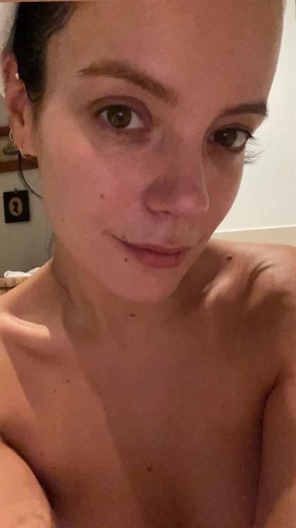 Lily Allen Pictures Lily Allen topless new selfie in her bathroom at home unfortunately not showing anything.