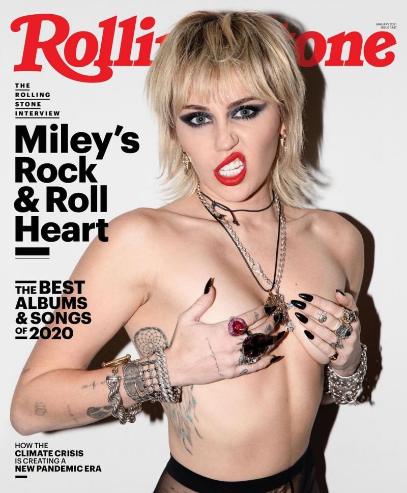 Miley Cyrus Pictures Miley Cyrus poses topless on the new cover of Rolling Stone magazine holding her nude tits.