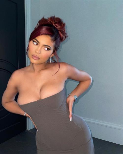 Kylie Jenner Pictures Kylie Jenner braless boobs showing nice cleavage with her big tits and sexy ass in a revealing dress that shows off her curves.