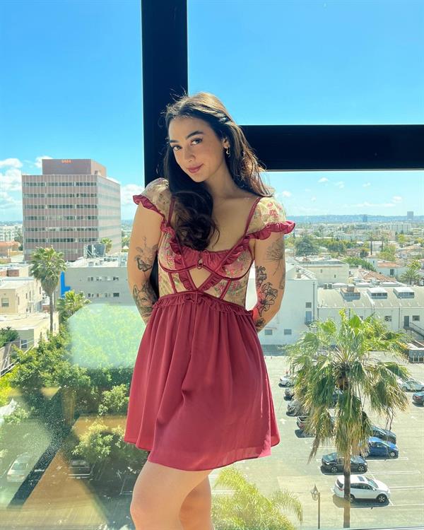 Alyce Rocha (aka Alyska on YouTube and Twitch) wearing a pink dress.