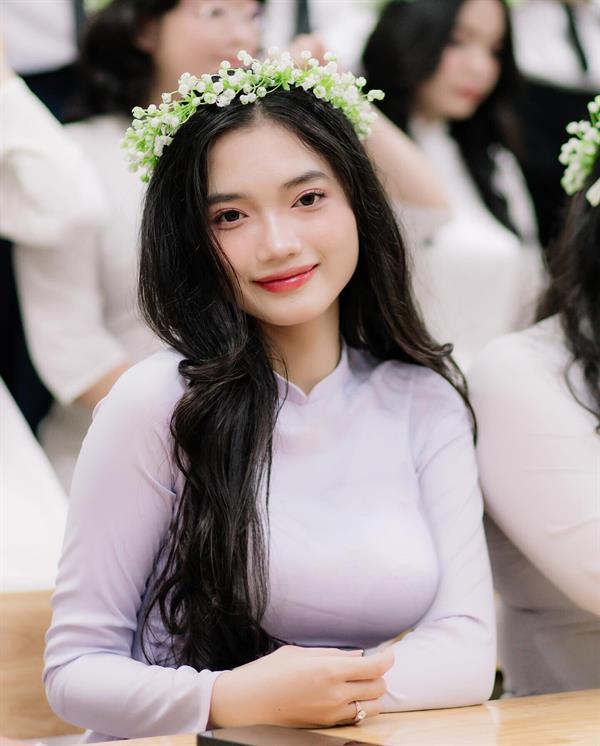 Young & pretty woman in ao dai dress