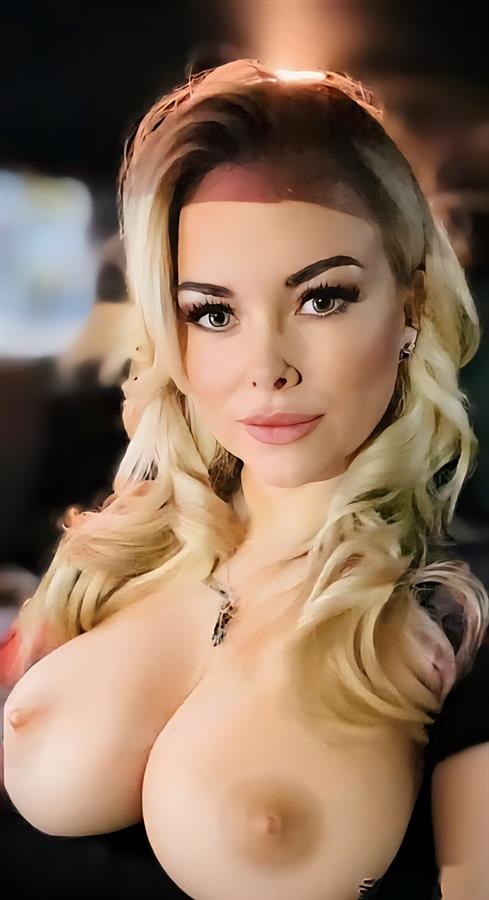 Whitney B taking a selfie and - breasts