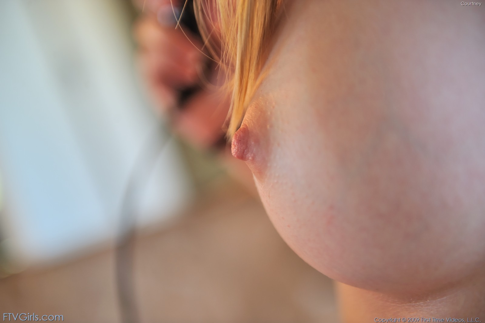 Courtney plays with her wet pussy