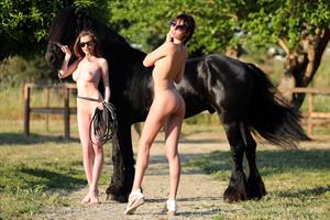 Emily & Lila Nude Pictures Emily & Lila: Having fun with the horse