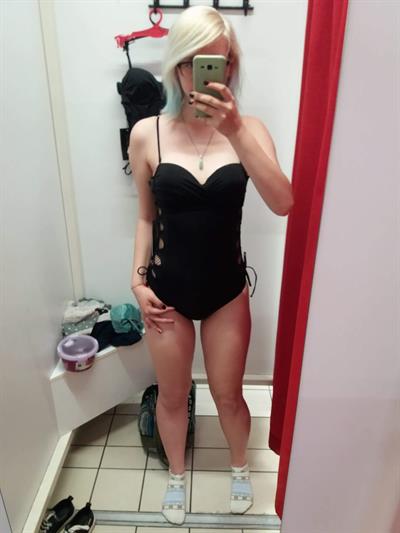 Katie in a bikini taking a selfie