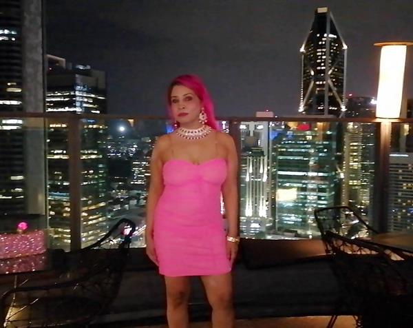 Celebrity Pink Babe on neon pink net costume in a movie  