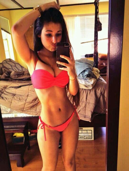 Angie Varona in a bikini taking a selfie