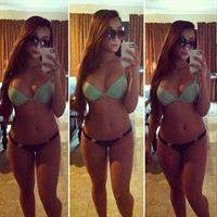 Angie Varona in a bikini taking a selfie