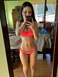 Angie Varona in a bikini taking a selfie
