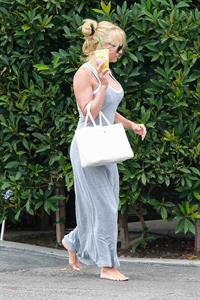 Pamela Anderson leaves barefoot a local Restaurant with a friend in Malibu July 6, 2013 